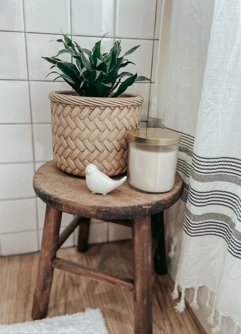 Cut down and reused and old wood stool for a cute little place to keep a candle and plant next to the tub. I love being able to use this stool while in the tub. Stool With Plant Decor, Bath Tub Side Tables, Wood Bathroom Stool, Stool By Bathtub, Bathroom Stools Decor Ideas, Stool Next To Bathtub, Bathroom Stool Styling, Plant On Stool, Bathroom Stool Ideas