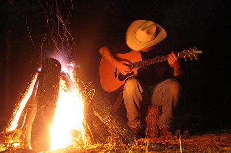 songs about texas Guitar Country Aesthetic, Campfire Guitar Aesthetic, Western Guitar Aesthetic, Country Album Covers Aesthetic Spotify, Guitar Around Campfire, Country Guitar Aesthetic, Campfire Guitar, Campfires Photography, Cowboy Boyfriend