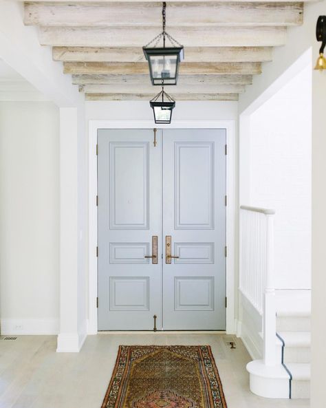 Benjamin Moore Cape May Cobblestone via Kate Marker Interiors. Love the black lanterns, light wood floors and ceiling beams. Interior Farmhouse Doors, Interior Front Door Color, Front Doors Painted Black, Interior Door Paint Colors, Farmhouse Interior Doors, Interior Door Colors, Interior Front Door, Painted Interior Doors, Blue Front Door