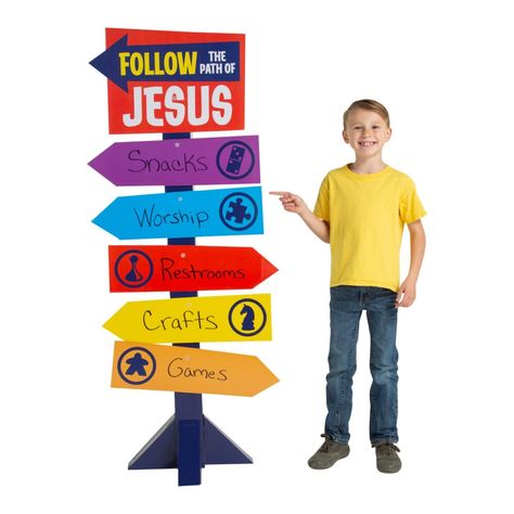 Topped with a sign that reads, "Follow the path of Jesus," this VBS sign will help you show VBS participants the way to their next activity. This directional sign gives you space on each arrow to write the VBS locations in permanent marker. Easily direct kids to the next part of their faith-filled summer adventure! Corrugated cardboard. 24" x 67" Assembly required. © OTCGames Vbs Directional Stand-Up Instructions Lifeway Vbs 2024 Decorations, Vbs Signs Ideas, Vbs Board Game Theme, Game On Vbs Decorations, Vbs Decorating Ideas, Church Game Night, Bible School Snacks, Childrens Ministry Decor, Treasured Vbs 2021 Decorations