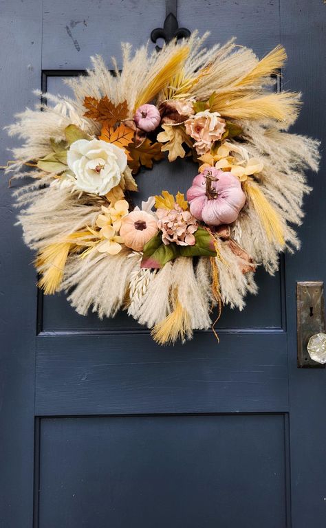 Beautiful 23" boho inspired neutral tone indoor or outdoor fall wreath, perfect to leave up through Thanksgiving. Accented with 3 velvet pumpkins, faux flowers and some wooden leaves. If this wreath is used outdoors it MUST be covered by a screen door. The materials used on this wreath need to be protected against the weather in order to preserve the wreath. Free shipping! Large clear plastic storage bag with handles included with every order.  I strive for 5 star feedback! I want you to love yo Fall Wreath With Pampas, Boho Wreaths For Front Door Autumn, Boho Fall Wreath, Pink Pumpkin Fall Wreath, Rust Pampas Grass Wreath, Outdoor Fall Wreaths, Wooden Leaves, Flowers Neutral, Pumpkin Flowers