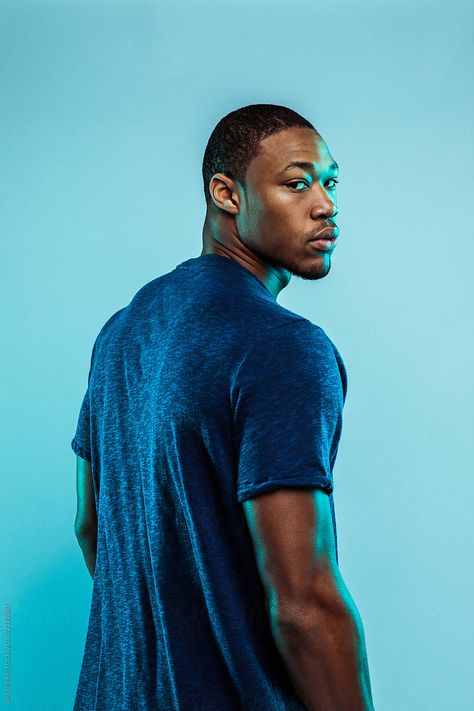 Black athlete in blue shirt, standing, looking at camera Shoulder Pose, Looking Over Shoulder, Infographic Inspiration, Black Person, Standing Poses, Man Standing, Guy Drawing, Perfect Image, Model Release