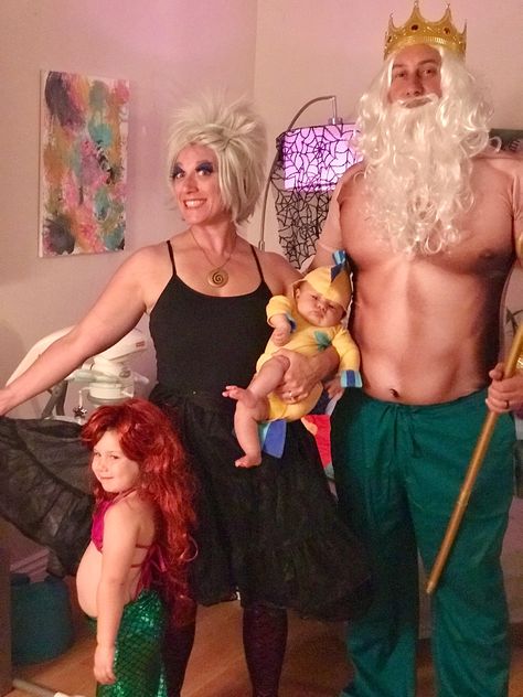 Little Mermaid costumes. King Triton, Ursula, Flounder and of course, Ariel. Triton: separate items purchased on Amazon, hand painted trident Ursula: separate Amazon items and hand pained necklace Ariel: purchased from Amazon Flounder: home sewn King Trident Costume, Diy King Triton Costume, King Triton Costume Diy, King Triton Costume, Flounder Costume, King Triton, Funny Couple Costumes, Mermaid Halloween Costumes, Mermaid Costumes