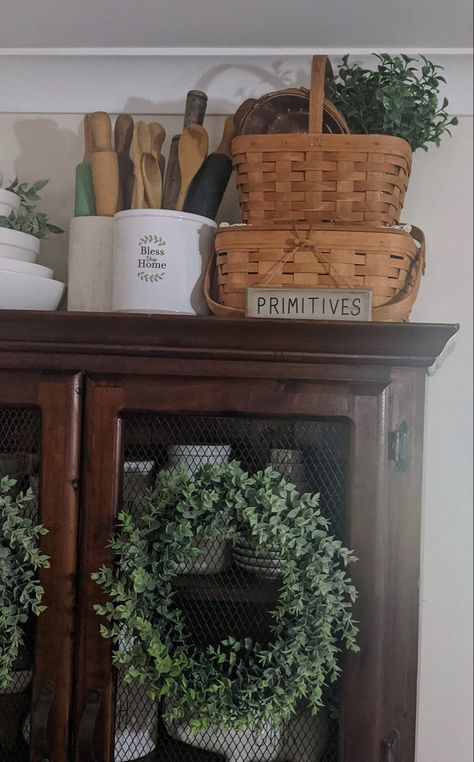 Country Antique Decor, Baskets On Top Of Cabinets, Rustic Basket Decor, French Country Above Cabinet Decor, Decorating With Wicker Baskets, Decor On Top Of Hutch, Baskets On Top Of Hutch, Farmhouse Baskets Decorating Ideas, Kitchen Canister Ideas