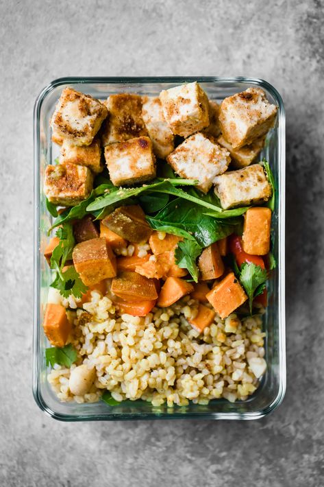 Vegan tofu bowls with sweet potato coconut milk sauce, spinach, sweet buttery macadamia nuts and brown rice. Made with organic Nasoya extra firm tofu. The perfect veggie packed lunch for meal prep! Coconut Tofu, Bento Box Lunch Ideas, Box Lunch Ideas, Tofu Bowls, Veggie Lunch, Lunch Foods, Veg Meals, Ambitious Kitchen, Vegan Tofu