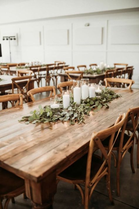 Silver Dollar Eucalyptus Wedding Table, Circle Table Eucalyptus, Farm Table White Runner, Eucalyptus And Wood Wedding Table Decor, Eucalyptus Wedding Centerpiece Simple, Wedding Table Centerpieces Eucalyptus, Farmhouse Table Florals Wedding, Wedding Table Garland With Candles, Candle Greenery Centerpieces Wedding