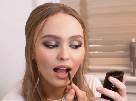 Lily Rose Depp makeup, Lily Rose Depp aesthetic, makeup aesthetic, glam, glam aesthetic, half up half down hair, applying lipstick, doing makeup aesthetic Applying Makeup Aesthetic, Applying Lipstick Aesthetic, Applying Lipstick Pose, Doing Makeup Aesthetic, Rose Depp Makeup, Lily Rose Depp Makeup, Lily Rose Depp Aesthetic, Applying Lipstick, Doing Makeup