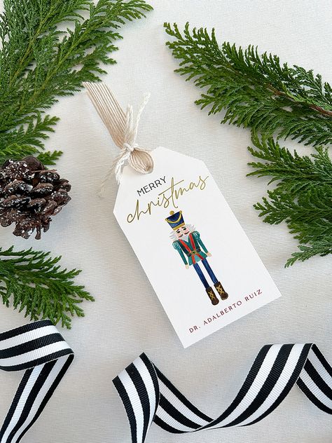 "▪ DESCRIPTION ▪ Dress up every Christmas gift that leaves your hands with these personalized Nutcracker gift tags! You can also use them as favor tags. You can buy them as an addition to your own desk, or as the perfect Christmas personalized gift for someone special. * Set of 12 2.5\" x 4.5\" gift tags. * Paper: fine 120# eggshell. Felt paper upgrade is available on our website. * Printing method: digitally printed with foil-pressed details. Foil-pressed name upgrade is available on our websit Xmas Prints, Personalized Christmas Tags, Christmas Name Tags, Custom Hang Tags, Christmas Gift Tags Personalized, Stocking Tags, Christmas Stationery, Christmas Favors, Creative Gift Wrapping