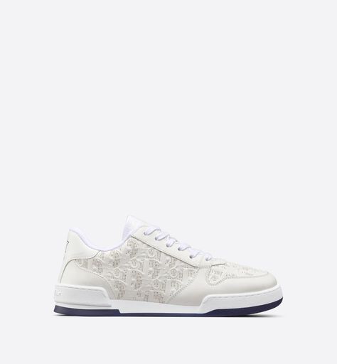 The season's new Dior One sneaker showcases the House's savoir-faire with a modern creation. Crafted in white calfskin, it is distinguished with perforated inserts that reveal the Dior Oblique motif. A star embellishes the insole, while the tongue features the 'Christian Dior PARIS' signature. The sneaker will complete all of the season's casual outfits. Designer Sneakers Women, Dior Star, Dior Sneakers, Dior Oblique, Christian Dior Couture, White Sneakers Women, Luxury Sneakers, Sneakers For Women, 2023 Collection