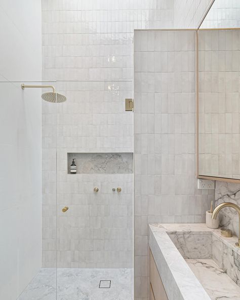 The master ensuite of our Gables project in Burraneer. A soft dreamy space designed for two to share. . . Key features being a double vanity custom made from Calacutta Vagli Marble and the outrageously tall double shower, positioned beneath a skylight accentuating the 4 metre peak of the raked ceilings. 🔥🔥🔥 #bathroomdesign #bathroom #bathroominspo #bathroomgoals #interiors #homedesign Raked Ceiling Bathroom, Tile Shower Double Head, Ensuite Bathroom Ideas Double Shower Head, Master Bath Skylight, Double Ensuite, Modern Bathroom Skylight Master Bath, Double Shower Ensuite, Vagli Marble, Skylight Bathroom