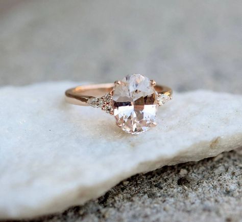 30 Dramatic engagement rings we love Bold Engagement Rings, Peach Champagne Sapphire, Champagne Sapphire, Peach Sapphire Rings, Oval Sapphire Engagement Ring, Peach Sapphire Engagement Ring, Pink Sapphire Ring Engagement, White Sapphire Engagement Ring, Peach Sapphire