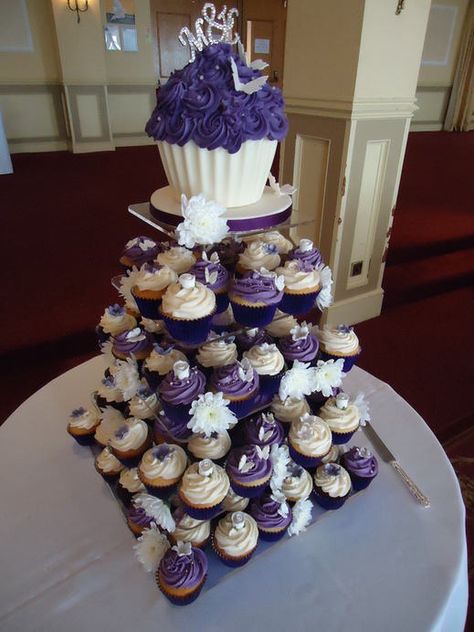 Purple/ivory wedding cupcakes - love the big one on the top! Are these still popular? I love this idea! So pretty! Wedding Cakes Purple, Purple Wedding Cupcakes, Branch Crafts, Wedding Cupcakes Decoration, Cakes Purple, Cupcake Towers, Giant Cupcake Cakes, Wedding October, Purple Bridal Shower