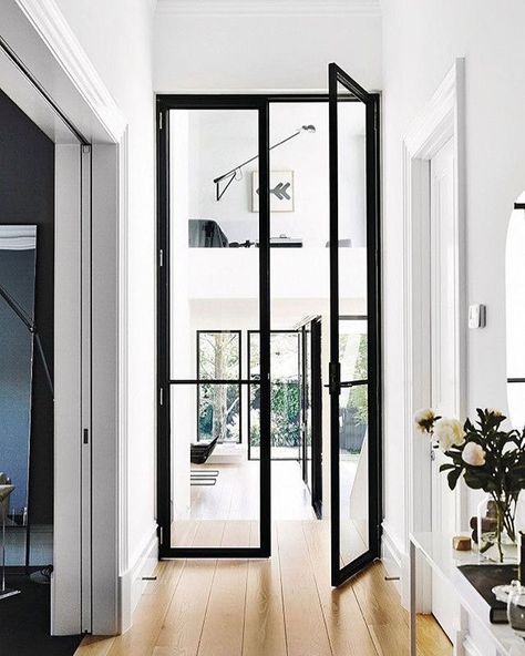 Step inside. Black steel and glass make a big statement in this hallway. Glass doors are a great way to bring natural light into a dark… Black Interior Doors, Interior Design Per La Casa, Revere Pewter, Hal Decor, Glass Doors Interior, Lighting Design Interior, French Doors Interior, Design Del Prodotto, Internal Doors