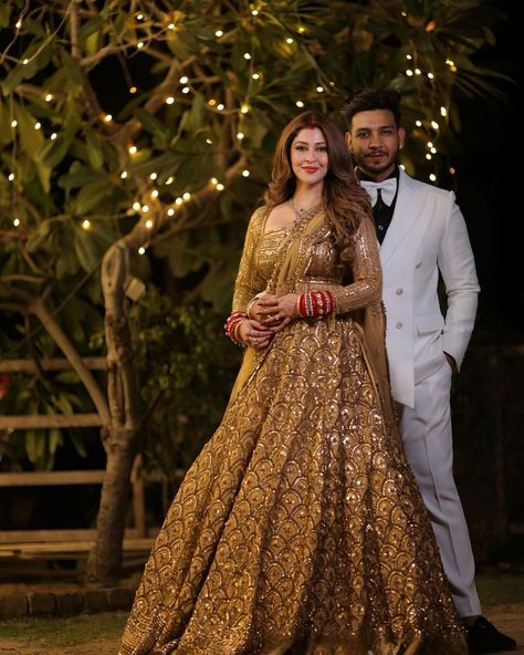 Keeping it gold @bsonarika for her wedding reception. #weddingseason #viralreels #weddingviral #viralbride #viralwedding #weddingphotography #wedding #weddingdress #weddingday #weddings #wreceptionlehenga #goldenlehenga #bridegroom #couplegoals #couple #couples #couplevideos #marriage #marriagetip #shadi #shadiseason #reelsinstagram #trending #trend #wishnwed #shaadi ( tellybride, viral wedding video, groom squad, devokedevmahadev, indian bridal entry, receptiondress , fishtail cut lehenga... Golden Lehnga Makeup Look, Reception Look For Indian Bride, Reception Look Indian Couple, Golden Lehenga Brides Receptions, Golden Reception Lehenga, Lehanga For Reception Bridal Couple, Couple Reception Look, Indian Bride Groom Outfits, Reception Look For Bride And Groom