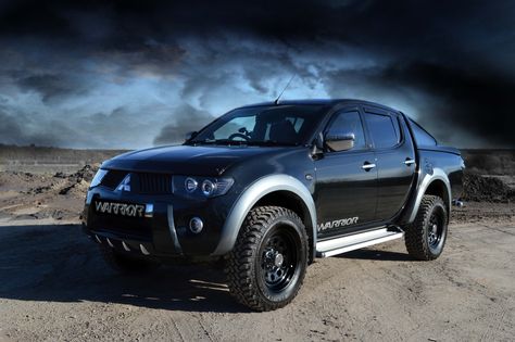 Mitsubishi L200 Warrior Fastback. RalliArt Tuned engine. Modular wheels.   32" off road tyres. Black front grill. Smoked black side lights. Eagle eye led Headlights. Smoke black rear lights. Mitsubishi Fastback rear. Smoke black window guards. Black rear quarter and fastback tints. Aluminium side runners. Stainless rear curved bumper. Smoke black bonnet guard. Reverse camera. dvd. Auto gearbox. Chrome wing mirrors. Mitsubishi L200 Modified, L200 Warrior, Triton 4x4, Mitsubishi Pickup, Mitsubishi Ralliart, Pick Up 4x4, Pickup Car, Van Storage, L200 Triton