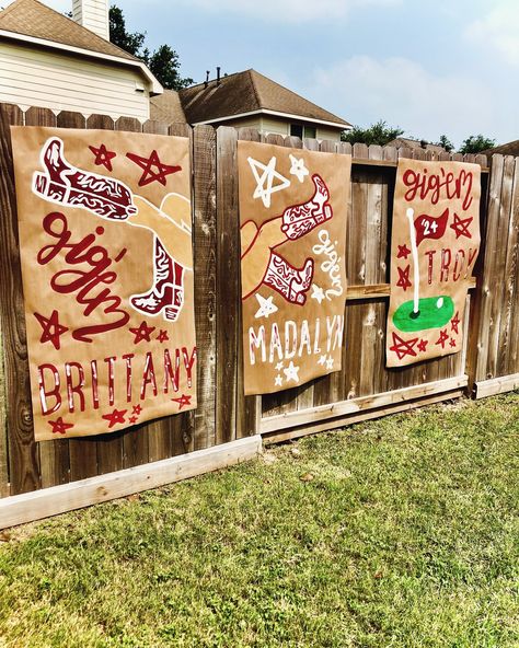 The cutest banners for these triplets!! 🤍 Gameday Banner Brown Paper, Painted Signs On Brown Paper, College Banner Design, Football Banner Ideas, College Banners, Cheer Homecoming, Brown Paper Banner, Aggie Ring Dunk, Aggie Ring Day