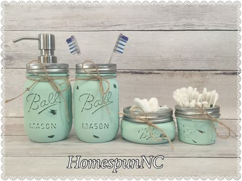 HomespunNCs Mint Mason Jar Bathroom Décor sets add a touch of rustic chic to any bathroom! These Mason Jars function as a multi-purpose organization and décor set and can be utilized in any room of your home or office. These sets make for thoughtful wedding and housewarming gifts, too! (Other set & color options are available in my shop)  Mint 6 piece set includes: 1 Quart Size Mason Jar Vase 1 Pint Size Mason Jar Stainless Steel Soap Dispenser 1 Pint Size Mason Jar Toothbrush Holder 1 H... Bathroom Decor Coastal, Rustic Farmhouse Bathroom Decor, Mason Jar Bathroom Decor, Mason Jar Toothbrush Holder, Coastal Bathroom Decor, Distressed Mason Jars, Rustic Farmhouse Bathroom, Quart Size Mason Jars, Mason Jar Bathroom