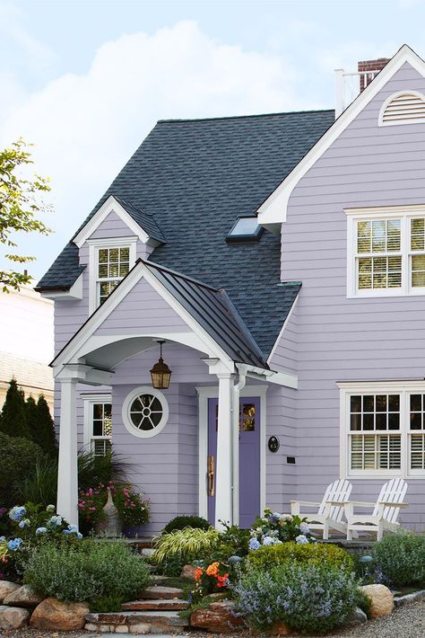 Lavender is an unexpected addition to an exterior color scheme, especially when paired with an equally colorful door. To tone down the hue, choose a pastel paint color with cool gray undertones. #exteriorpaintcolorsforhouse #homeremodel #colorschemes #bhg Yellow House Exterior, Exterior Color Combinations, Pastel Paint, Purple House, Lavender Cottage, Exterior House Paint Color Combinations, Exterior House Color, Home Exterior Makeover, Exterior Paint Color