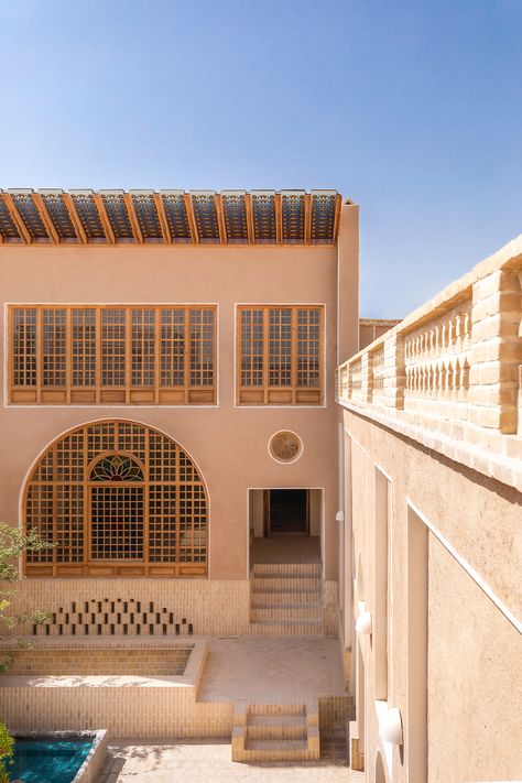 The special location of this project in the oldest roofed alley of Isfahan and next to Naghsh Jahan Square has created special conditions for this building. The building, which was going through a period of decline, was identified by our consultant after about 10 years of being abandoned, and after receiving the participation of several friends of heritage, it has been revived today and it is one of the most attractive places in the south of Naghsh-e-Jahan Square. Moroccan Architecture Exterior, Public Library Design, Hotel Design Architecture, Hotel Landscape, Isfahan Iran, Hotel Facade, Iranian Architecture, Persian Architecture, Hotel Exterior