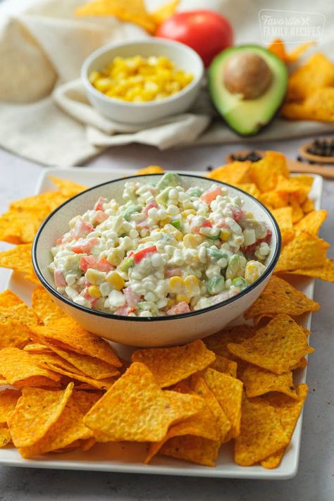 Doritos Dip is a cool mild dip that is loaded with avocados, tomatoes, corn, and cottage cheese. It is the perfect flavorful dip to compliment nacho cheese Doritos! #doritodip #doritorecipe #dorito #chips #chipsanddip #chipdip #diprecipe #chipdiprecipe #FavoriteFamilyRecipes #favfamilyrecipes #FavoriteRecipes #FamilyRecipes #recipes #recipe #food #cooking #HomeMade #RecipeIdeas Doritos And Dip, Dip For Doritos Recipes, Doritos Dip Recipes, Cottage Cheese Dorito Dip, Dorito Dip Recipe, Dorito Recipes, Cream Cheese And Bacon Stuffed Doritos, Doritos Dip, Dorito Seasoning Nacho Cheese