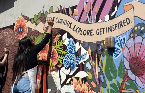 Westminster High School student Perla Baranda a mural based on artist Tory ElenaÕs work at Westminster High School on Friday, May 24, 2019. The school was the only California school selected for a grant from Americans for the Arts. (Photo by Kyusung Gong/Contributing Photographer) Highschool Art, School Wall Art Ideas, Surreal Garden, Garden Of Flowers, School Awards, School Murals, Murals Street Art, High School Art, Student Created