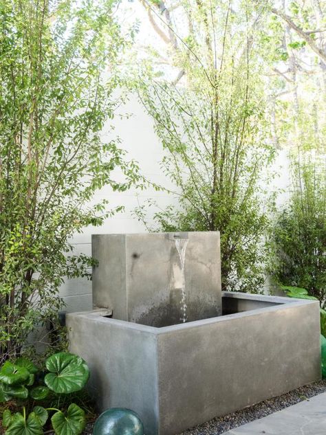 70 Outdoor Water Feature Ideas | HGTV Contemporary Fountain, Modern Water Fountain, Modern Outdoor Fountains, Contemporary Water Feature, Stone Water Features, Patio Fountain, Water Wall Fountain, Concrete Fountains, Fountain Ideas