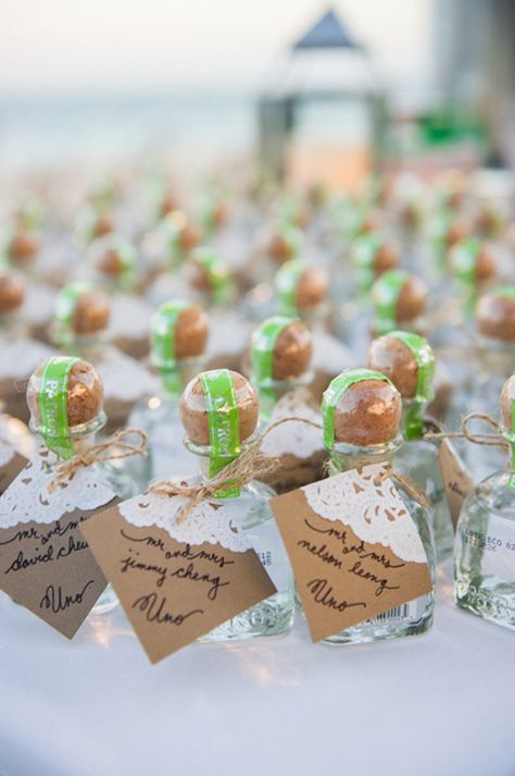 Bottles of Patron, which also double as favors | Brides.com Alcohol Wedding Favors, Wedding Alcohol, Wedding Favor Table, Destination Wedding Favors, Wedding Favors Ideas, Creative Wedding Favors, Edible Wedding Favors, Gift Favors, Cancun Wedding