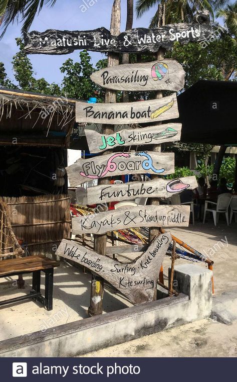 Download this stock image: Signs of water sports offer, Maafushi, Maldives, Asia - 2B4FGE1 from Alamy's library of millions of high resolution stock photos, illustrations and vectors. Maafushi Maldives, Shed Cabin, Banana Boat, Parasailing, Jet Ski, Kite Surfing, Water Sports, Maldives, Diving