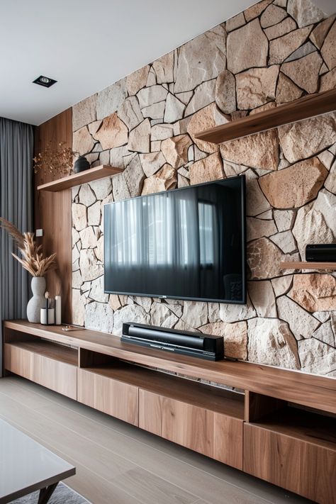 Transform your TV wall into a focal point with these modern design ideas. See more inspiration here. Accent Wall Behind Tv, Wooden Media Console, Wall Behind Tv, Wall Speakers, Tv Wall Ideas, Grey Accent Wall, Stone Accent Walls, White Floating Shelves, Metal Light Fixture