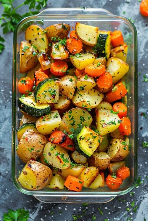 Craving a side dish that’s both delicious and healthy? This recipe for Garlic Herb Roasted Potatoes, Carrots, and Zucchini is a dish so flavorful that it’s sure to convert even the pickiest eaters into veggie lovers.

Gluten-free, dairy-free, vegan, and Whole30 compatible, it’s a healthy and delicious choice for everyone. Side Dishes For Potatoes, Roasted Potatoes Carrots Zucchini, Ways To Prepare Vegetables, Roasted Potatoes Zucchini And Squash, Roasted Potatoes And Zucchini In Oven, What To Eat With Fish Side Dishes, Heart Healthy Potato Recipes, Garlic Herb Roasted Potatoes And Carrots, Potato And Vegetable Bake