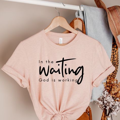 🌸 “In the Waiting, God is Working” 🌸 Sometimes, it’s hard to trust the process, but remember, God is always at work, even when we can’t see it. Let this T-shirt be a reminder that your patience and faith are never in vain. Rock this shirt as a testament to your unwavering belief that God’s timing is perfect. Wear your faith proudly and let the world know: God is always working on your behalf. ✨ #FaithFashion #ChristianApparel #GodIsWorking #FaithInAction #TrustInHim #ChristianWomen #Purpos... God Is Working, Remember God, Divine Timing, Business Idea, Trust The Process, Christian Women, Business Plan, Christian Clothing, Shirt Ideas