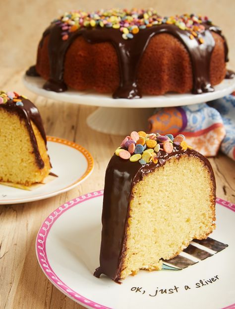 Yellow Bundt Cake with Dark Chocolate Ganache is one of my favorite celebration cakes, thanks to its crowd-pleasing flavors and ease of preparation. Just add sprinkles! - Bake or Break ~ http://www.bakeorbreak.com Yellow Bundt Cake, Bundt Cake Ideas, Chocolate Garnishes, Ganache Cake, Pillsbury Recipes, Dark Chocolate Ganache, Bundt Cake Recipe, Lemon Bundt Cake, Happy Yellow