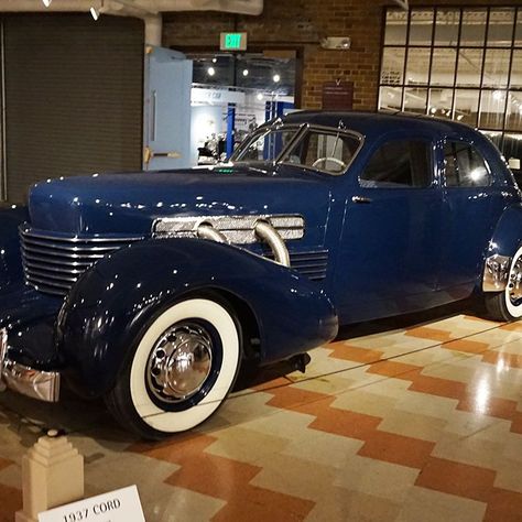 In 1937, the Cord 812 was introduced with an optional long 132-inch wheelbase chassis called the Custom. With an extra 7 inches in length and 1.5 inches in interior headroom, the rear sear became much more accessible. Gordon Buehrig stated the larger Cord "was a result of criticism that the car in the price class it was in didn't have enough room in it for some people's taste." You will notice there are eight hood louvers, instead of seven. This is a visual cue of the Custom's added dimensions. The sheet metal panels for the Custom were not only fabricated, but also modified from a standard Sedan body. This required more body solder, or lead, which meant greater hand finishing. But the low cost of skilled labor ruled out the expense of creating large dies to press large single panels. Tech Cord Automobile, Cord Car, Antique Cars For Sale, Old Vintage Cars, Visual Cue, Fast Sports Cars, Vintage Muscle Cars, Classic Cars Trucks Hot Rods, Old Classic Cars