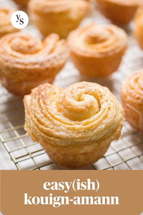 up close of a kouign-amann bun on gold cooling rack with text 'easy(ish) kouign-amann' Laminated Dough, Puff Pastry Desserts, Kouign Amann, Croissant Recipe, Breakfast Rolls, Savory Pastry, Cookies Pastry, Cinnamon Bun, British Baking