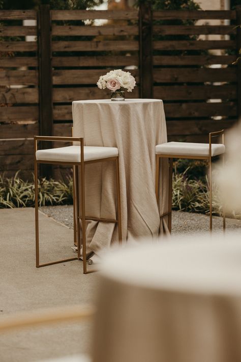 This image is during a wedding cocktail hour. Featuring a cocktail table with blush and white florals in a 4x4 glass cylinder vessel. The linens on the cocktail tables are a champagne metallic twist. Cocktail Wedding Table Decor, Wedding Cocktail Table Decor, Cocktail Hour Tables, Wedding Cocktail Tables, Cocktail Table Decor, Top Table Flowers, White Cocktail Tables, Wedding Cocktail Hour, Modern Cocktail Tables