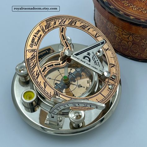 A Beautiful Sundial Compass, Perfect Gift for any occasion, Christmas, Birthday, Anniversary, Wedding Gift etc. Personalized engraving on the back makes it more unique and personal. You can have NAME, DATE, QUOTE, GPS COORDINATES, IMAGE or LOGO engraved on the back. Size of the compass is 4" approximately. Material of compass is brass. Finish : SILVER AND COOPER FINISH The compass and sundial are working pieces, compass shows you accurate direction and sundial helps you know the time in a fashio Engraved Compass, First Communion Gifts, Gps Coordinates, Communion Gifts, Baptism Gifts, Silver Work, Anniversary Wedding, First Communion, Birthday Anniversary