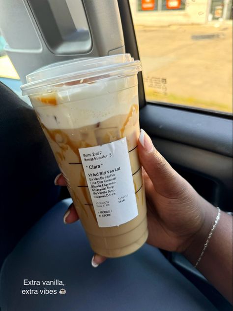 A hand holding a Starbucks cup with an Iced Vanilla Latte, topped with extra caramel drizzle, in a car. Starbucks Caramel Iced Coffee, Iced Coffee Orders, Starbucks Coffee Orders, Caramel Latte Starbucks, Starbucks Vanilla Latte, Starbies Drinks, Iced Vanilla Latte, Coffee Orders, Vanilla Iced Coffee