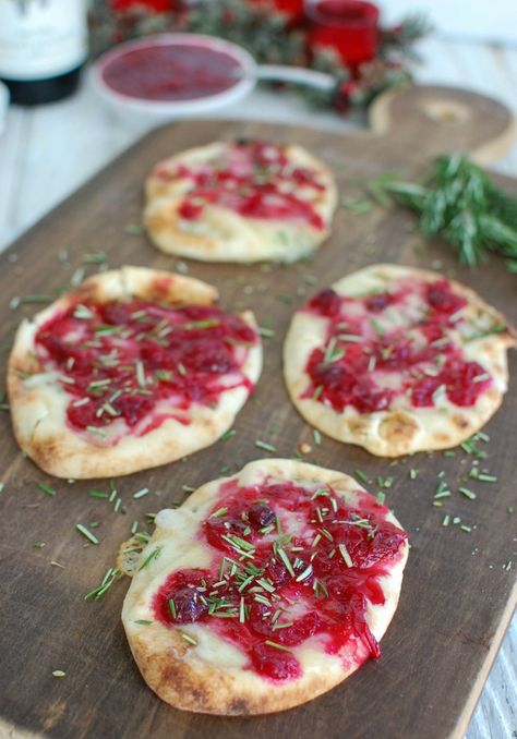 Warm Brie Cranberry Naan is a festive, naan-traditional holiday appetizer. Mini naan bread is topped with warm, creamy brie cheese, a sweet cranberry sauce, and finished off with freshly chopped rosemary.// A Cedar Spoon AD Mini Naan Bread, Warm Brie, Mini Naan, Brie Cranberry, Healthy Christmas Recipes, Recipes With Naan Bread, Spaghetti Meatballs, Naan Recipe, Holiday Appetizer