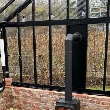 Jøtul Stoves on Instagram: "A little recap of @burlinmarianne ‘s gorgeous greenhouse🌱 Have you moved into your greenhouse yet?  #jotul #jøtul #greenhouse #greenhouselife #woodburningstove #fireplace #gardeninspiration #gardenlove #greenhouses" Green House With Wood Stove, Fireplace In Greenhouse, Stove In Greenhouse, Greenhouse Fireplace, Greenhouse With Fireplace, Greenhouse Heating Ideas, Greenhouse Heaters, Greenhouse Farming, Pot Belly Stove