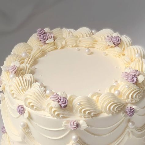 April’s Baker on Instagram: "All cream with purple accents💜" Lavender Heart Cake, Tangled Cake Ideas, Birthday Cake Ideas Purple, Lavender Theme Birthday Party, Purple Vintage Cake, Lavender Birthday Cake, Purple And White Cake, Purple Flower Cake, Birthday Cake Purple