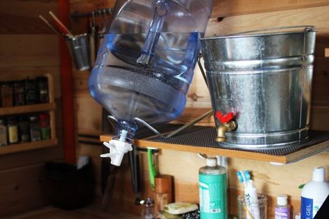 Here's What the Kitchen in a Sustainable Micro Cabin Looks Like — Inspiring Kitchens Inspiring Kitchens, Kitchen Spotlights, Micro Cabin, Tahoe Cabin, Small Solar Panels, Cabin Diy, Tahoe California, Off Grid Cabin, Stainless Steel Table