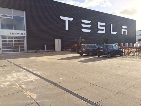 New Tesla European Headquarters: Amsterdam, Netherlands. Tesla Headquarters, Tesla Showroom, Tesla Factory, Warehouse Design, New Tesla, Car Showroom, Video Wall, Amsterdam Netherlands, Tesla