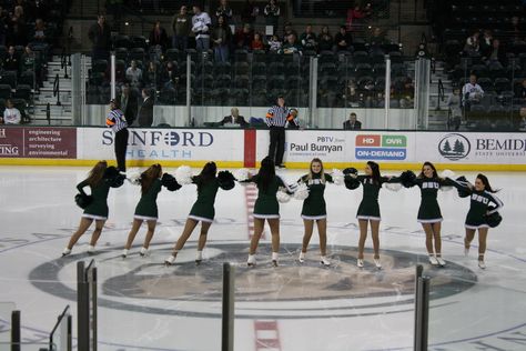 Bemidji State hockey cheerleaders performing a pinwheel. Hockey Cheerleaders, Nhl Hockey Cheerleaders, College Ice Hockey Aesthetic, Bemidji State University, Yale Cheerleaders, Winnipeg Jets Hockey, Paul Bunyan, Nashville Predators Hockey, Environmental Health