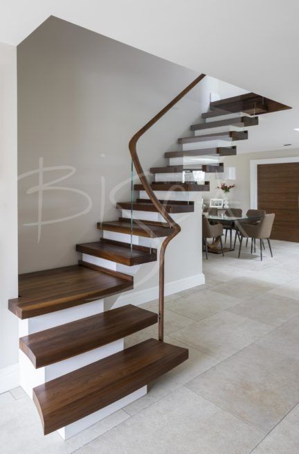 Bifurcated Staircase Design, Cantilever Staircase, Floating Wooden Staircase, Floating Stairs Traditional, Stair Bookshelf, Stair Lights Indoor, Painted Stair Railings, Cantilevered Stairs Detail, Wooden Staircase Design