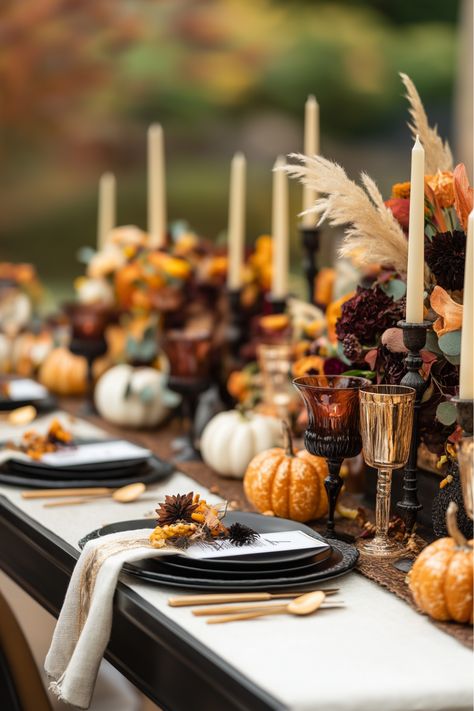 Why not go for a moody Friendsgiving tablescape this year? Dark tones like deep red florals, velvet runners, and candlelight create such a bold and unforgettable atmosphere. It’s rustic, modern, and so unique! Don’t you think this dramatic look would make your Thanksgiving dinner stand out? Moody Thanksgiving Tablescape, Moody Thanksgiving, Friendsgiving Table Decor, Friendsgiving Tablescape, Friendsgiving Table, Green Tablescape, Woven Charger, Modern Tablescape, Unique Dinner