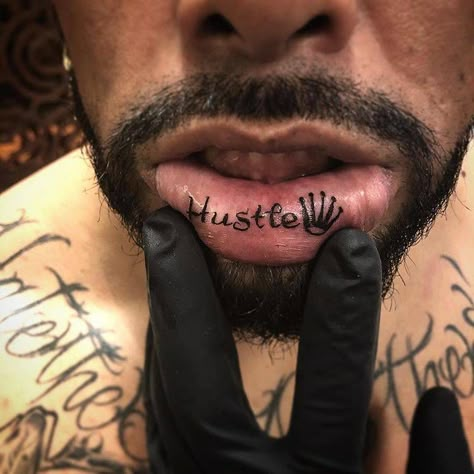 Inner lip “Hustle” tattoo. Inner Lip Tattoo Men, Word Tattoos For Women, Lip Tats, Inner Lip Tattoo, Loyalty Tattoo, Side Tattoos Women, Bicep Tattoo Men, Gang Tattoos, One Word Tattoos