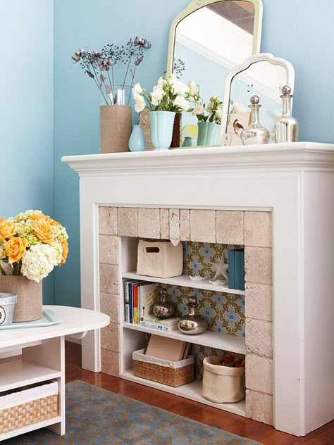 A bookcase inside a (non-working) fireplace. Genius! Cut Shelves, Unused Fireplace, Fireplace Bookshelves, Fake Fireplace, Fireplace Cover, Pretty Storage, Faux Fireplace, Diy Fireplace, Fireplace Ideas