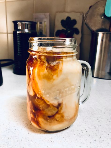 Iced coffee in a mason jar with milk mixing in Mason Jar Aesthetic, Coffee In Mason Jar, Mason Jar Coffee, Iced Coffee Mason Jar, Mason Jar Iced Coffee, Mason Jar Coffee Mug, Mason Jar Coffee Aesthetic, Mason Jar Smoothie Aesthetic, Iced Coffee Mason Jar Aesthetic