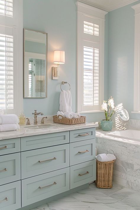 Our coastal bathroom decor ideas are a breath of fresh ocean air. Find the perfect balance between beach themes and elegant style, utilizing tiles that reflect the beauty of the sea, suitable for both large and small spaces. Hawaiian Bathroom Ideas, Pastel Green Bathroom, Coastal Bathroom Decor Ideas, Ocean Bathroom Ideas, Light Blue Bathroom Ideas, Powder Room Storage, Coastal Bathroom Ideas, Unique Bathrooms, Light Blue Bathroom