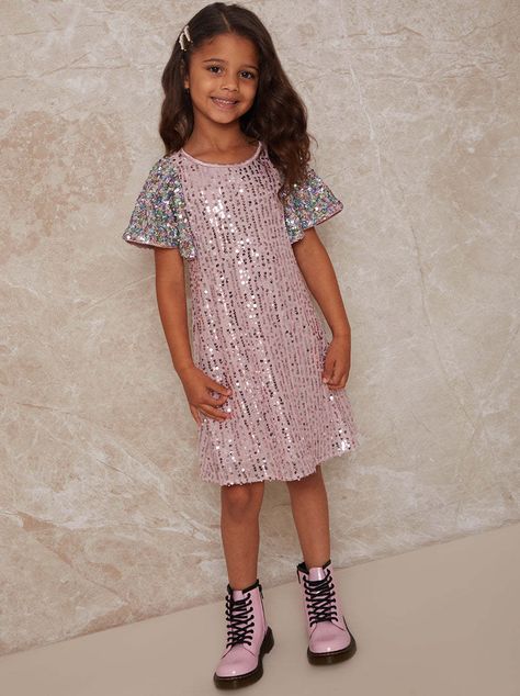 GIRLS SHORT SLEEVE SEQUIN MIDI Comfortable Fit Sequin Overlay Product Code: 53201GPI The perfect dress to get the party started. you little one will look cute and adorable in this sequin dress, with flared short sleeves in a pretty pink its a wardrobe must have! Ideal For: Birthday Parties! Girls Occasion Dresses, London Kids, Shimmery Dress, Latest Fashion Dresses, Sequin Midi Dress, Get The Party Started, Pink Midi Dress, Stylish Kids, New Arrival Dress